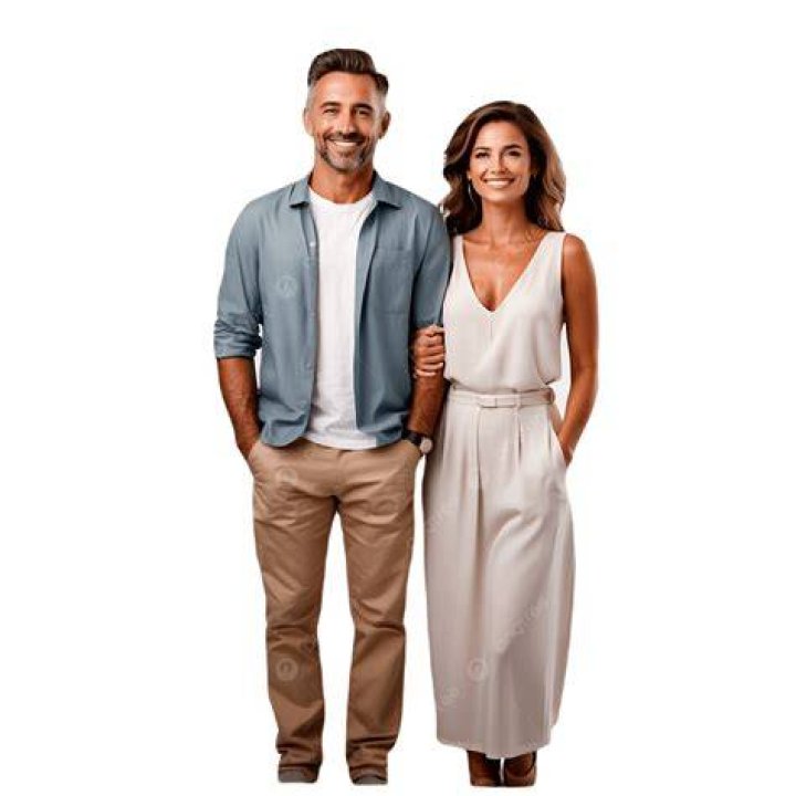 a man and woman standing next to each other on the red carpet at an