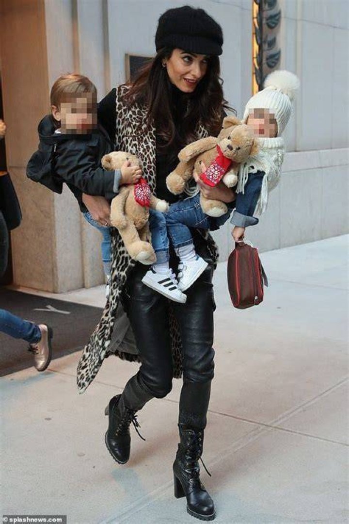 Amal Clooney holds her oneyearold twins Ella and Alexander Amal