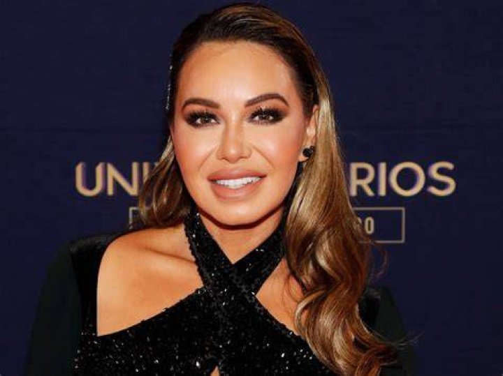 Chiquis Rivera poses showing off her rear in front of the mirror with