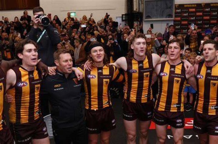 Hawthorn Hawks great Dermott Brereton and his partner arrive for the