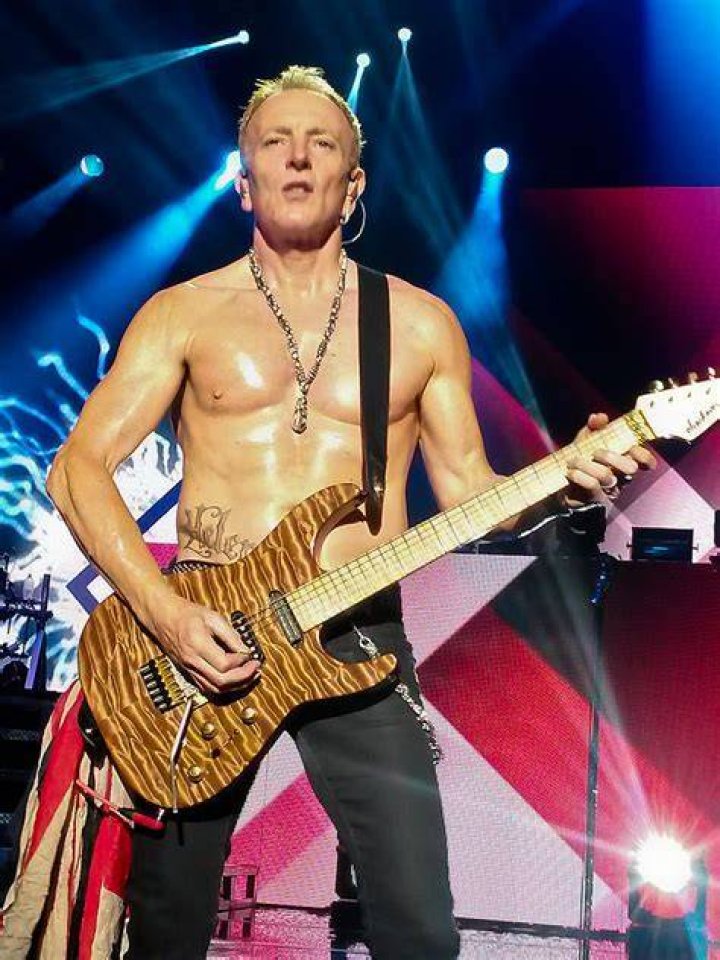 Phil Collen of Def Leppard and wife Helen L. Simmons attend... News