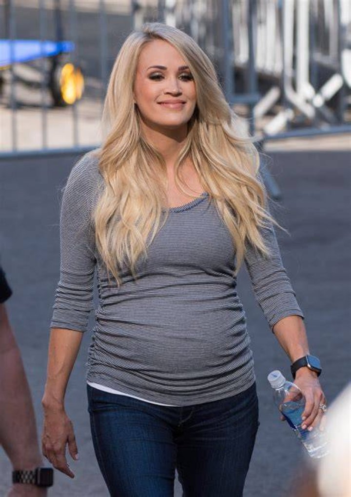 Pregnant CARRIE UNDERWOOD at American Country Countdown Awards 2014 in